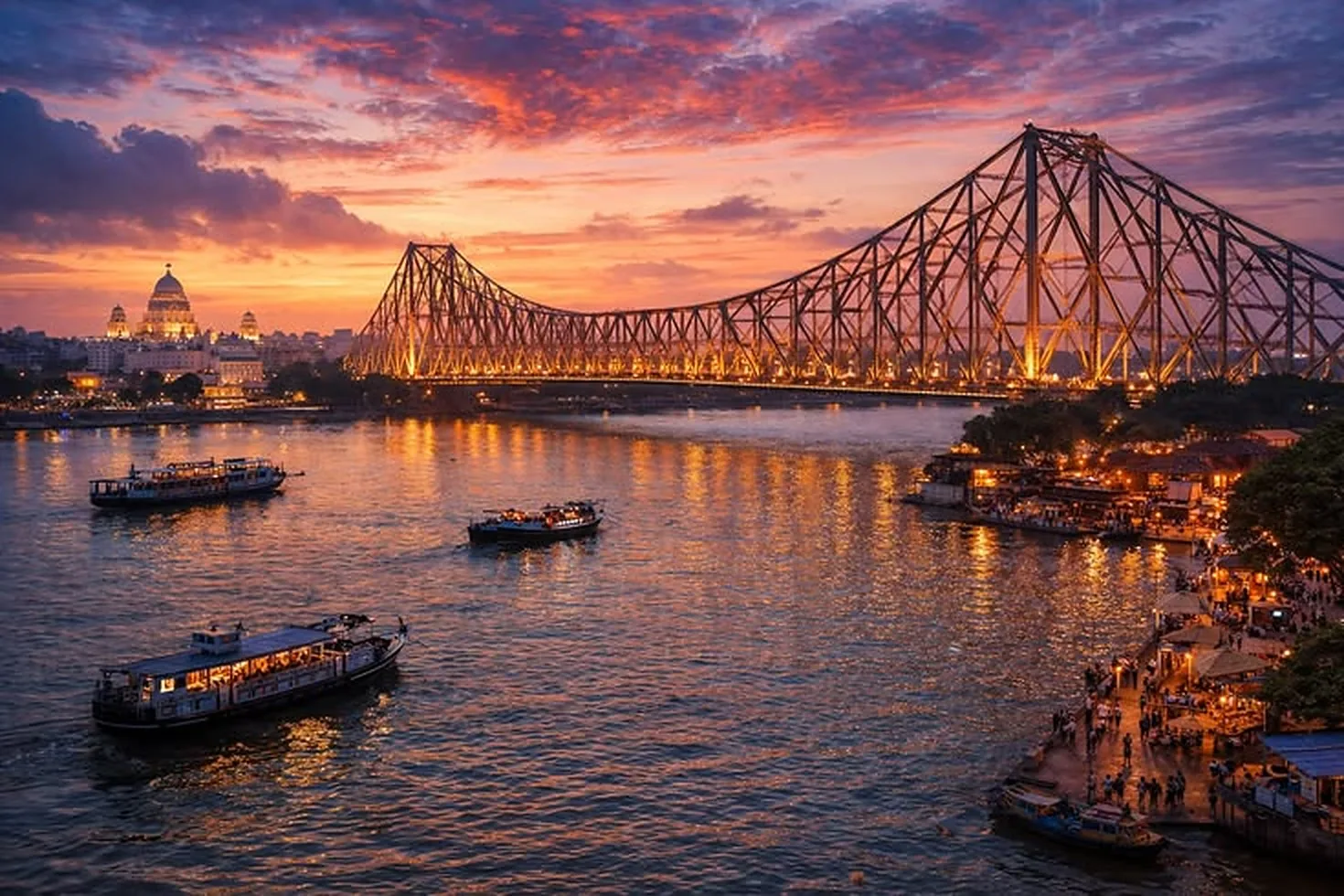 Howrah Bridge lit up at sunset over the Hooghly river, with ferries on the water